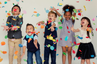 Children celebrating with confetti.
