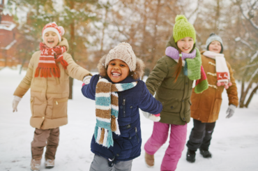 Kids playing outdoors in the winter.