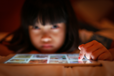 Young girl using tablet.