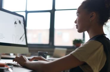 Middle school student working at a computer.