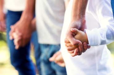 Family holding hands.