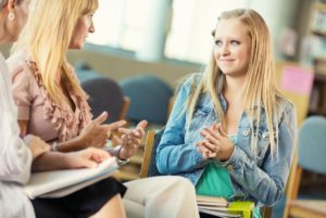 Student with school counselor.