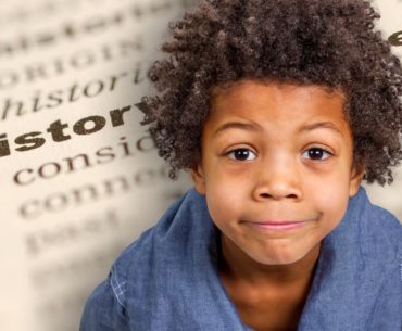 Photo illustration of a smiling child superimposed over an image of an open book.