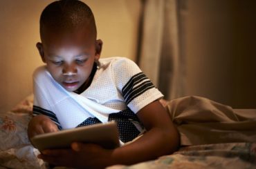 Boy using tablet.