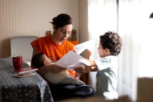 Mom at home with kids applying for a job.