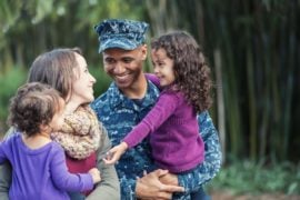 Military family smiling together.