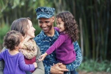 Military family smiling together.