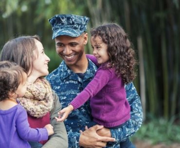 Military family smiling together.