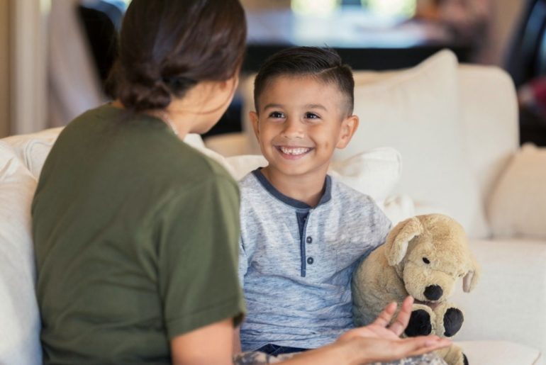 Mother and son smiling and talking.