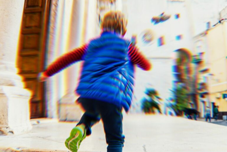 Child blurred because they're running.