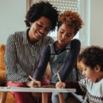 Mother and kids working together on creative project.
