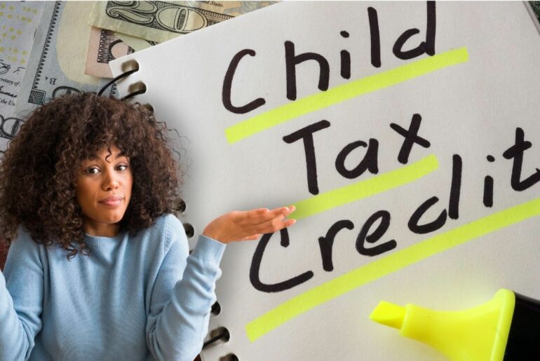 Woman shrugging over Child Tax Credit writing on notebook in background.