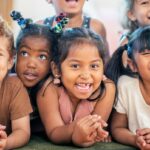 Diverse group of smiling school children.