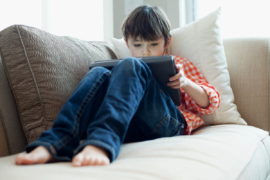 Young boy playing on iPad