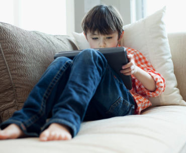 Young boy playing on iPad