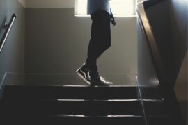 Student walking up stairs.