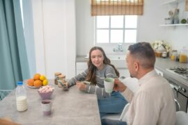 It can be hard to find time to connect with teens, so this dad is grabbing a minute to talk to his teenage daughter over breakfast.