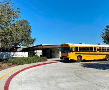 A school bus outside Finney Elementary School. The school is part of the Chula Vista Elementary School District, which has housed homeless students and families in hotels.