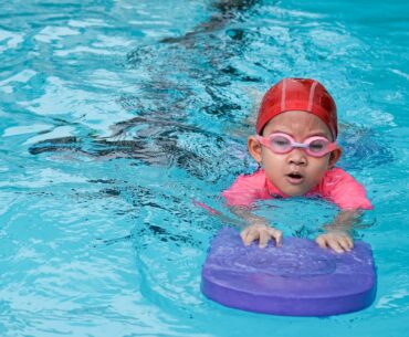 Child swimming in pool