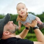 Dad playing with baby