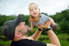 Dad playing with baby