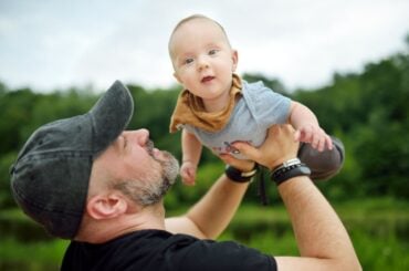 Dad playing with baby