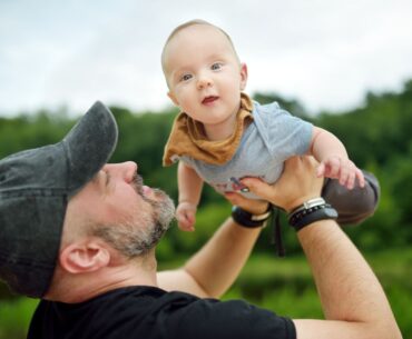 Dad playing with baby