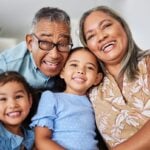 Grandparents smiling with grandkids