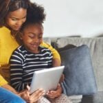Mom and child watching video on tablet