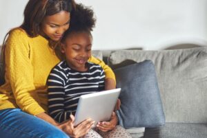 Mom and child watching video on tablet