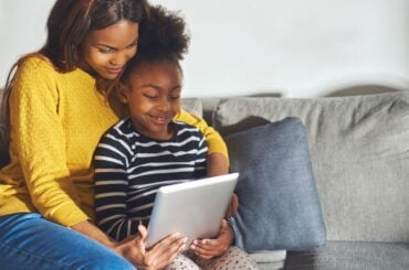 Mom and child watching video on tablet