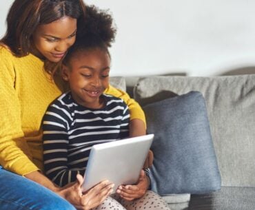 Mom and child watching video on tablet