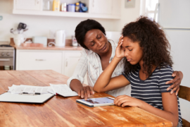 Mom comforting anxious teen