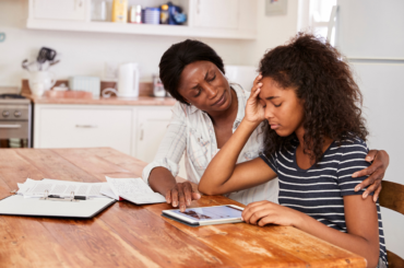 Mom comforting anxious teen