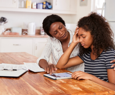 Mom comforting anxious teen