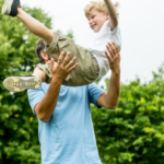 Dad playing with son