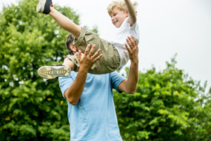 Dad playing with son