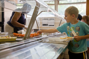Child getting school lunch.