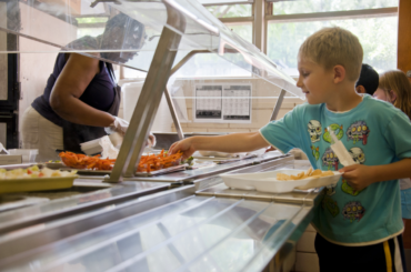 Child getting school lunch.
