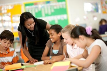 Teacher with students in the classroom