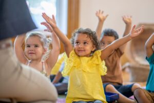 Preschool kids following teacher