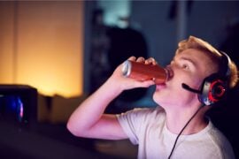 Teen boy drinking energy drink
