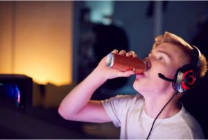 Teen boy drinking energy drink
