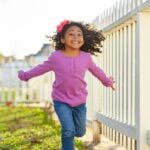 High-energy kid running outside
