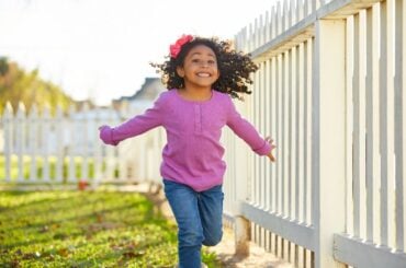 High-energy kid running outside