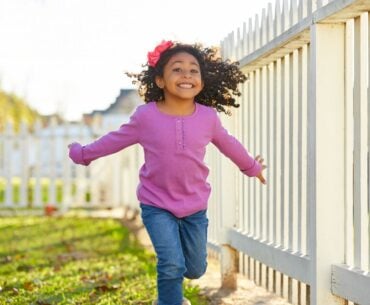 High-energy kid running outside