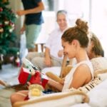 Teen receiving Christmas gifts