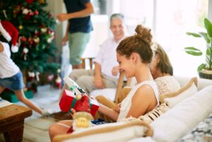 Teen receiving Christmas gifts