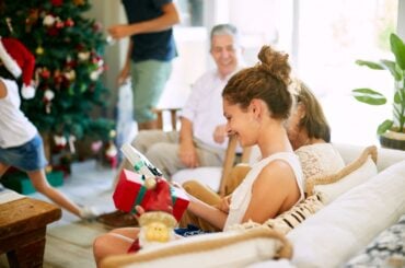 5 signs your kid might be ready for a smartphone this holiday season Teen receiving Christmas gifts