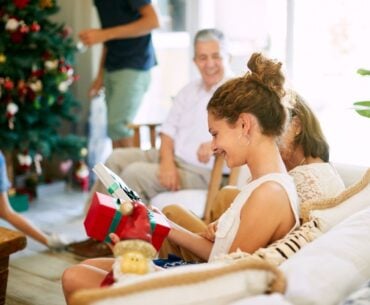 Teen receiving Christmas gifts